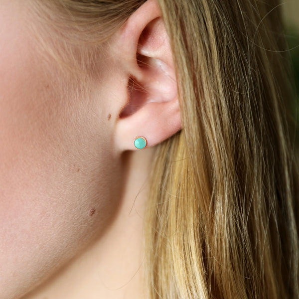 Kingman Turquoise earrings on ear 14ct gold 4mm
