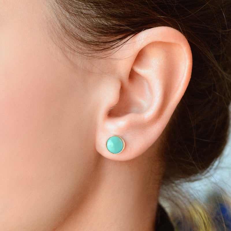 Kingman Turquoise earrings on ear 14ct gold 8mm